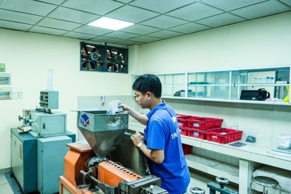 PVC compound laboratory performing quality testing and batch sample inspection