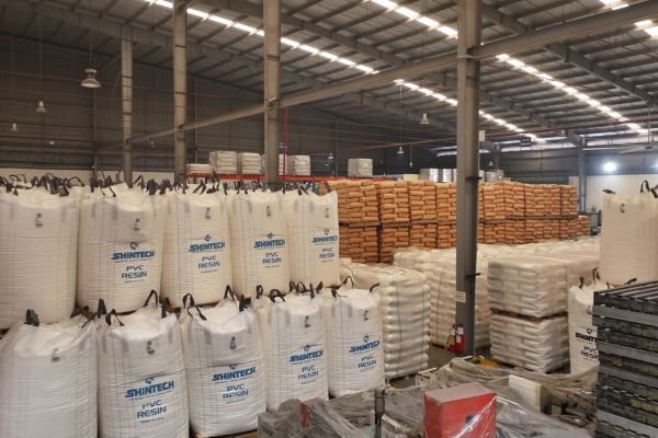 PVC resin raw material warehouse with organized storage for consistent PVC compound production